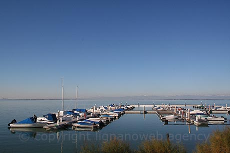 Boat docks in Lignano Sabbiadoro harbour photo