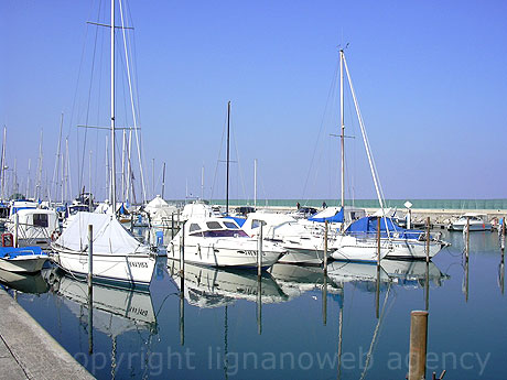 Boats inside the port of Lignano photo